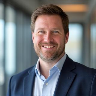 Professional headshot of Ben Carter.